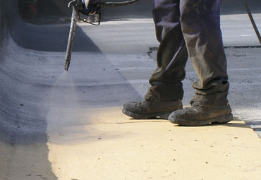 Coating systems over Oceanside spray foam roof systems