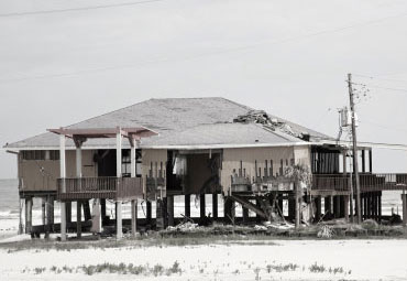 Wind damage - spray foam can help prevent uplift to Oceanside roofs